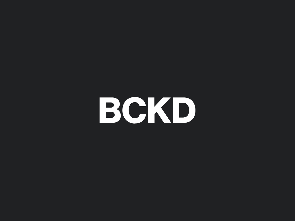 Backed Studios minimal white BCKD logo on a dark grey background.